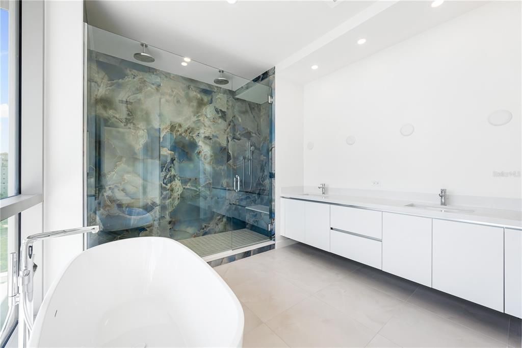 Primary bath with custom 110" porcelain slabs