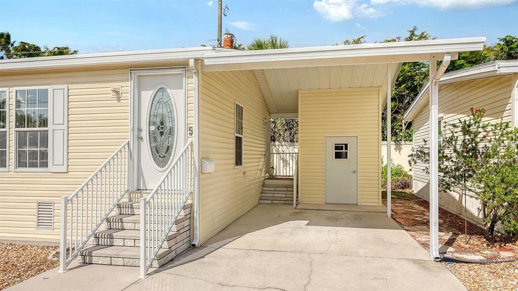 Front Door Entry with Steps, Carport, Carport Entry Door with Steps & Storage Shed.