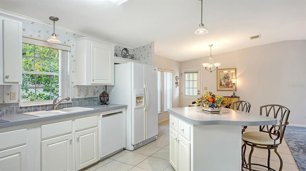 Spacious Kitchen with an Island for Storage & Breakfast Bar.