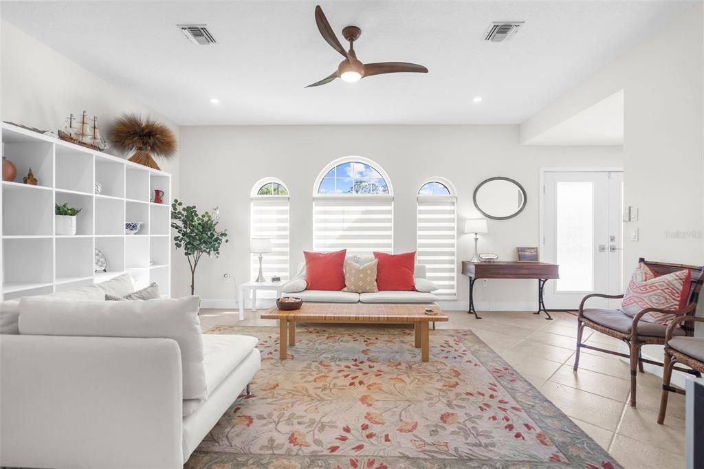 Living room, custom blinds and fan