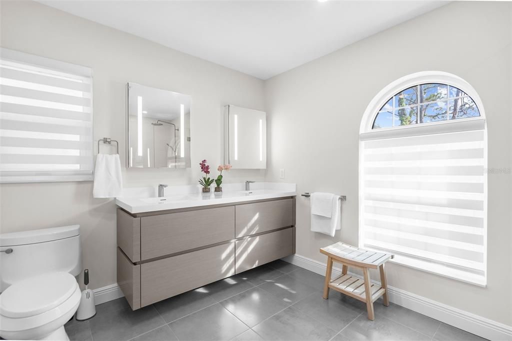 featuring a modern double vanity