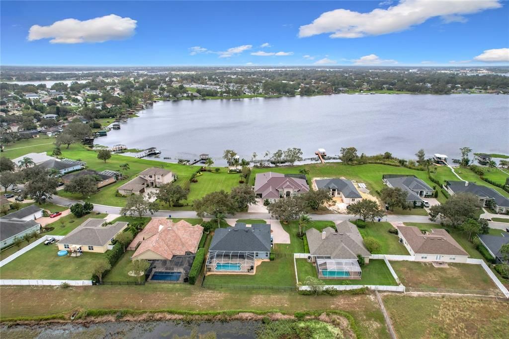 Aerial of the home, neighbors and the lake