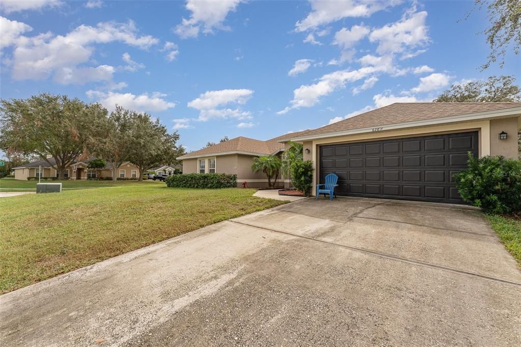 Front elevation from an angle of this beautiful home with the large 2 car garage on the right