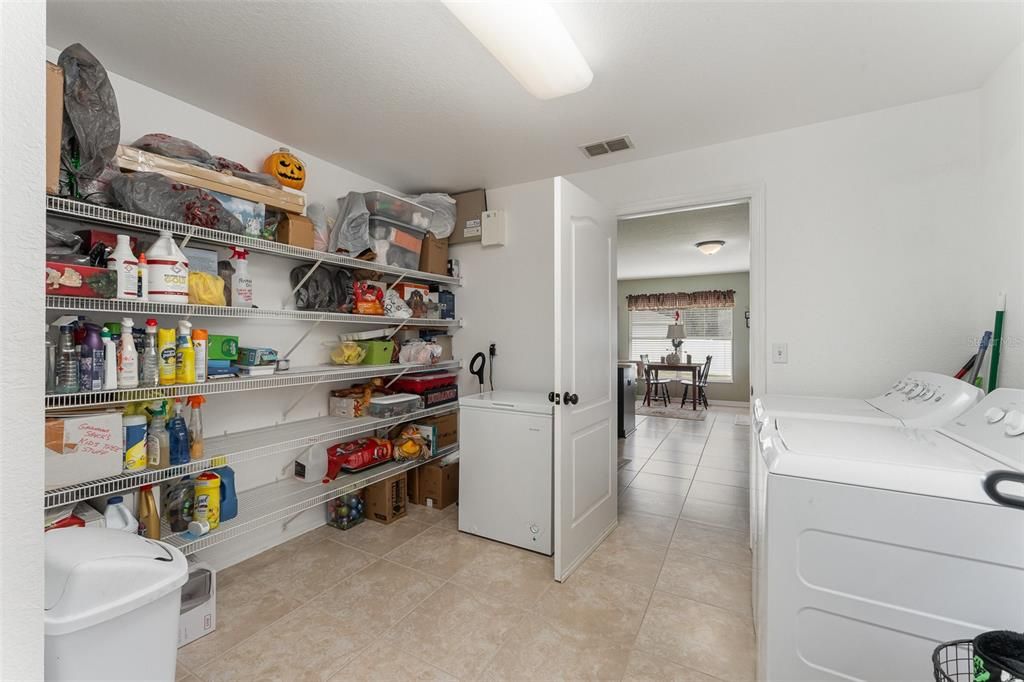 Very large pantry room with washer and dryer this is between the kitchen and the garage