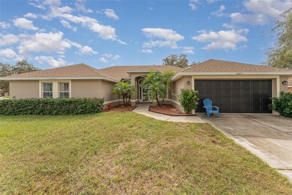 Front elevation of this beautiful home with the large 2 car garage on the right