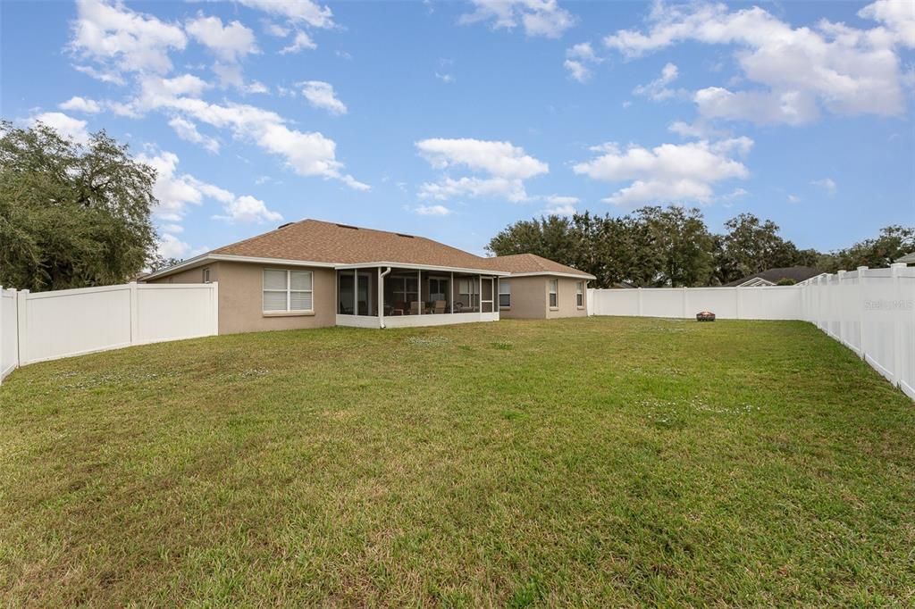 View of the spacious fenced back yard