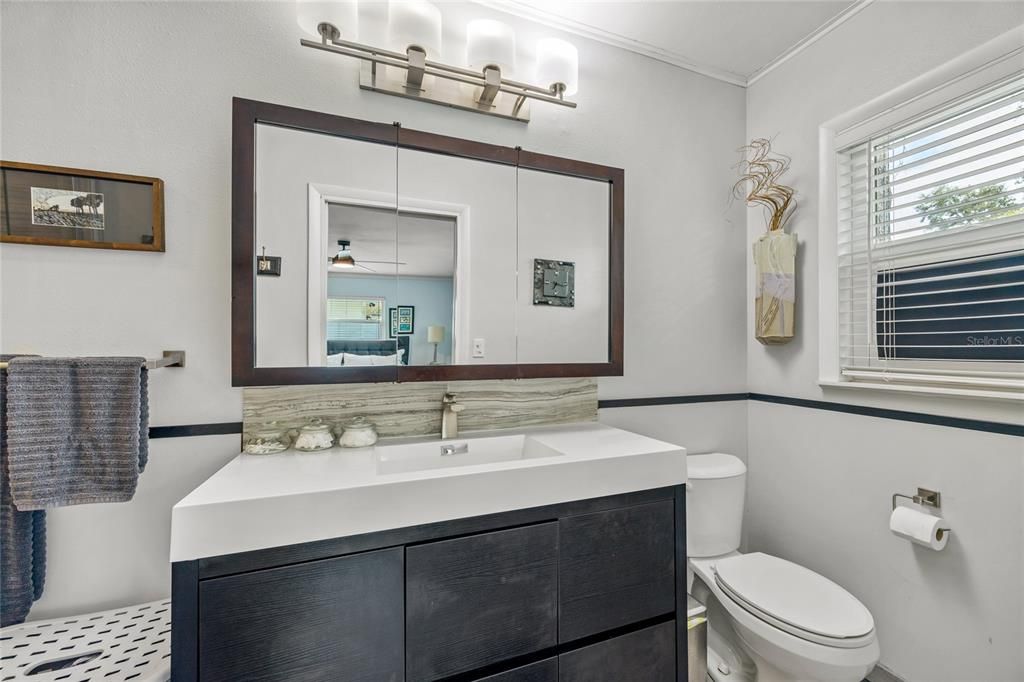 Floor to ceiling tile on the walls and a frameless glass shower door really define this luxury bathroom!