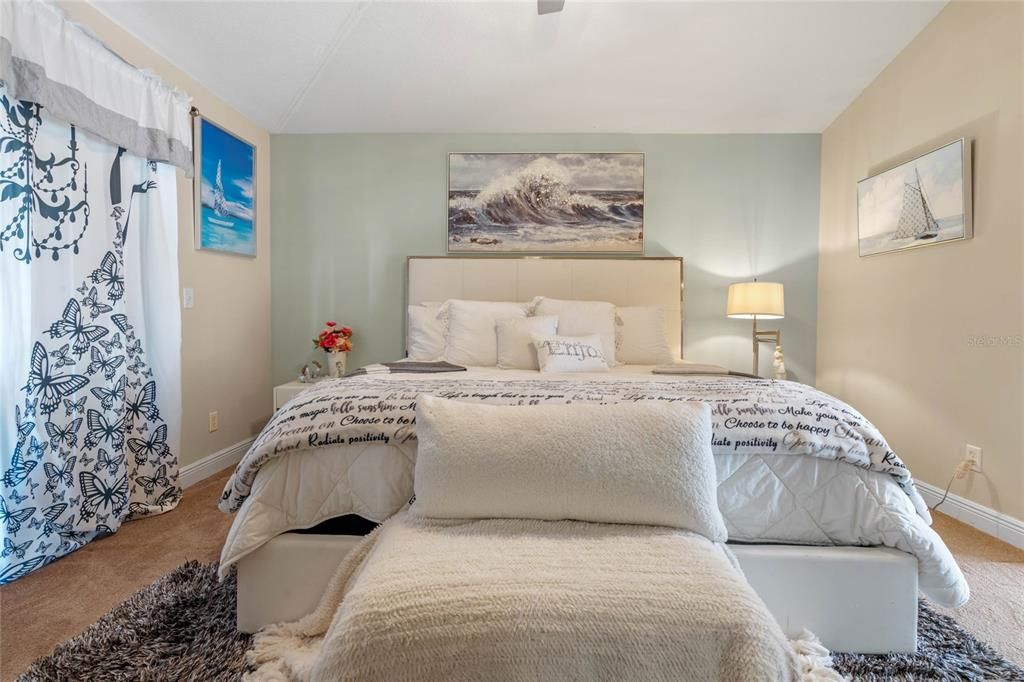 Primary Bedroom with Vaulted Ceiling & Sliding Doors