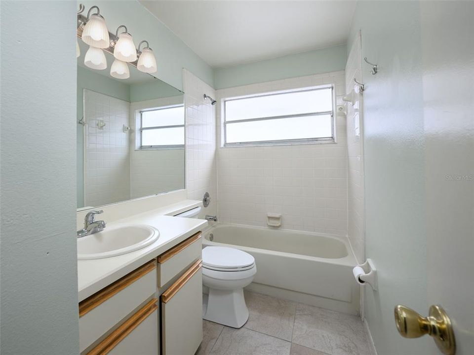 The secondary bath with bathtub.