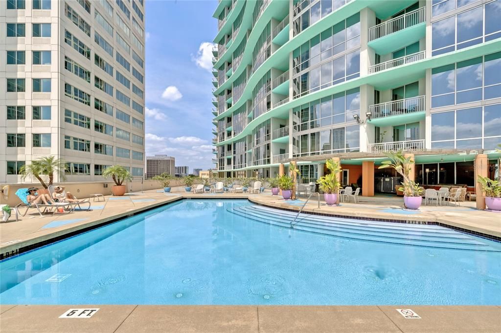 5th floor Pool, west facing pool, with seating, hot-tub and grilling areas