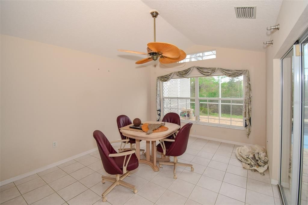 Extra-large eat in kitchen with separate dining area.  Also has sliding doors that opens up to the pool area making it perfect for entertaining a large number of guest.