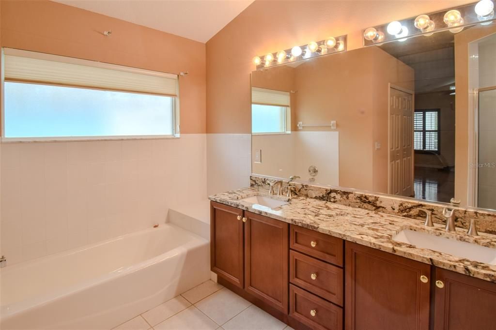 Extra-large master bathroom with separate tub and shower.  Granite countertops and dual sinks.