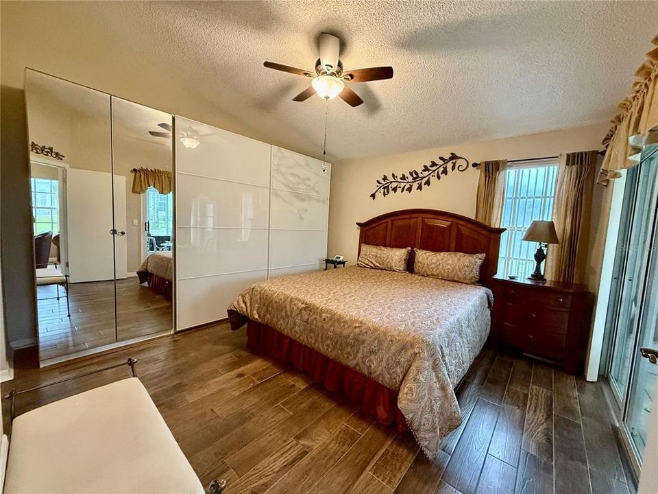 Primary bedroom with closet system for extra storage.