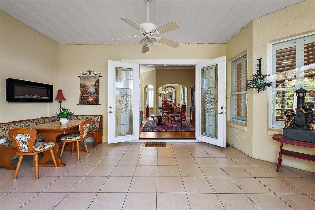 Enclosed lanai with French doors to living room.