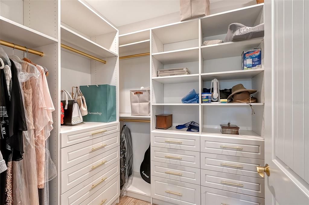 Huge walk in closet with built ins