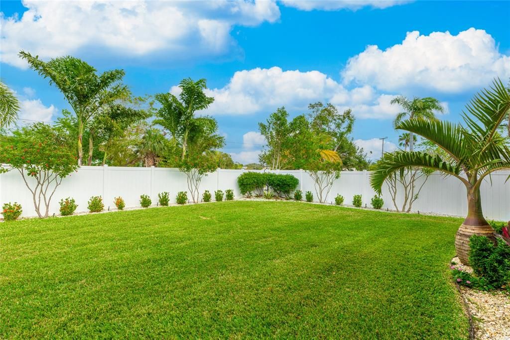 Lush landscaping maintained by an efficient sprinkler system and private well keeps this yard vibrant year-round.