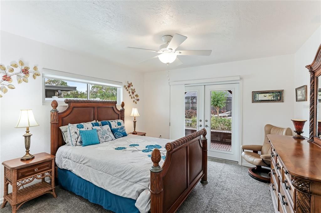 Guest Bedroom 2, offering the same convenient access to the peaceful outdoor pergola for a private retreat.