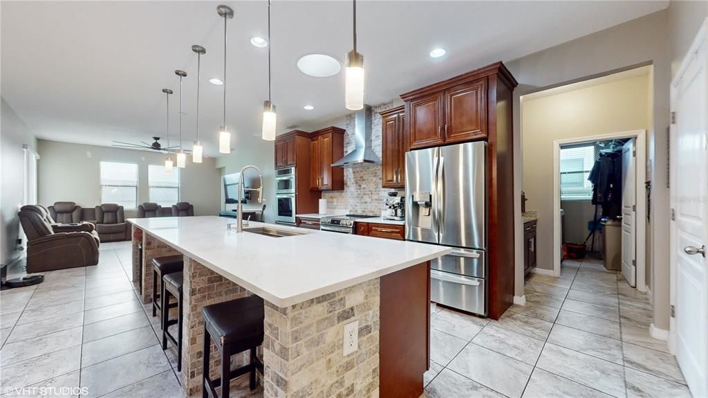 Kitchen/Great Room hallway with dry bar leads to laundry room