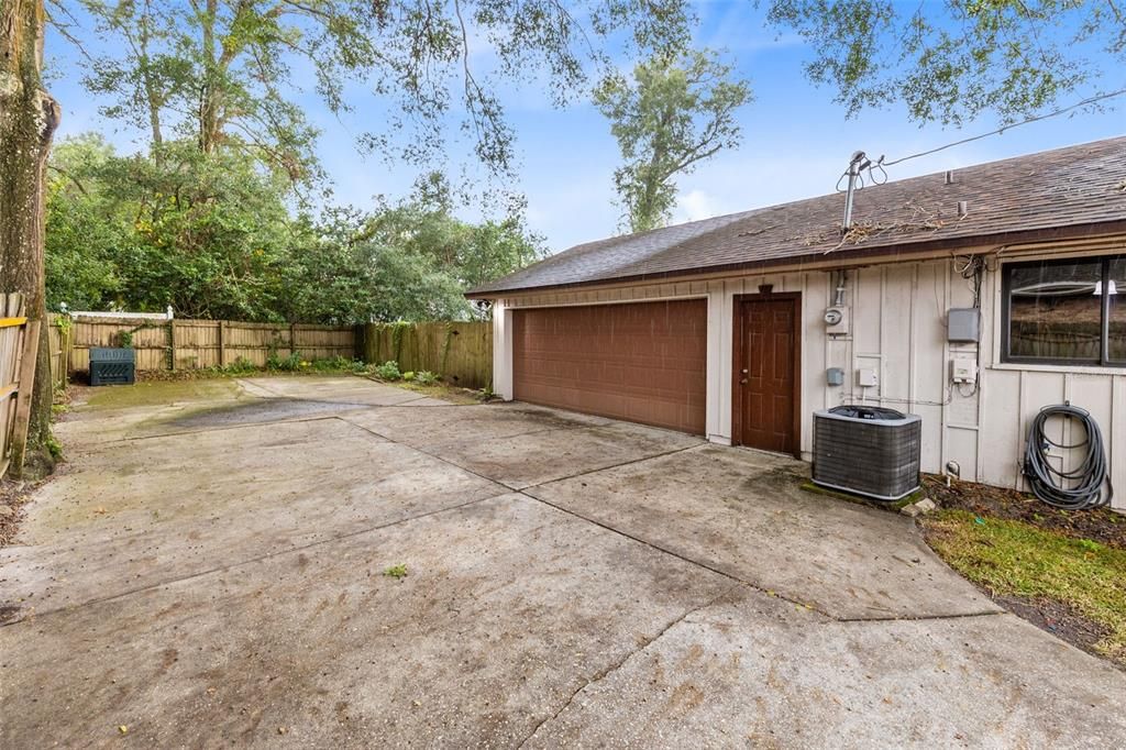 Parking Pad and LEFT SIDE entry garage perfect for privacy and offers a lot of space