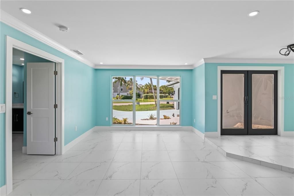 Double custom etched doors welcome you to your new home! So much natural light abounds throughout this magnificent home!