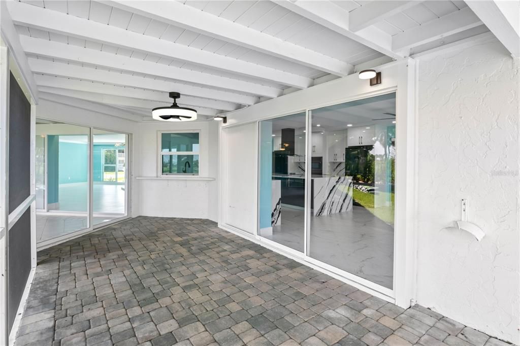 One of two screened and covered patios that provide the perfect amount of shade and also additional living area!