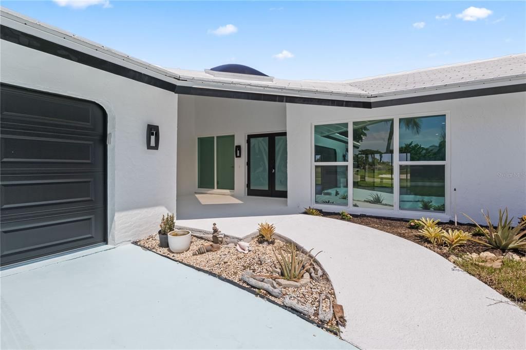 Welcome home to a wonderful large front patio with plenty of room for seating!