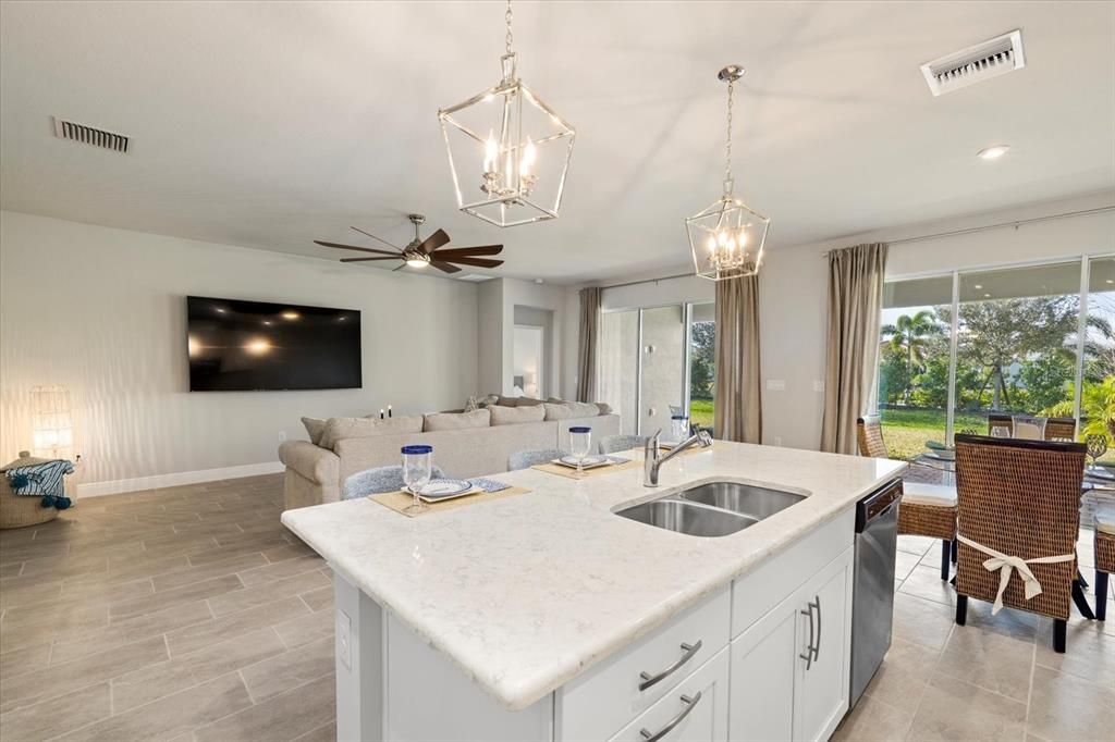 Kitchen overlooking Dining and Living Rooms