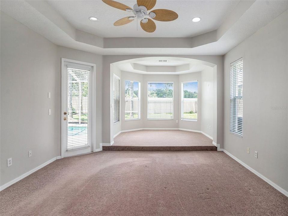 Primary bedroom with extended sitting area