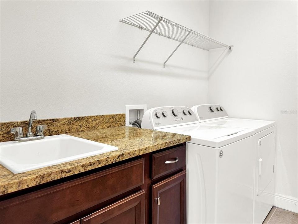 Spacious Laundry Room with Cabinetry