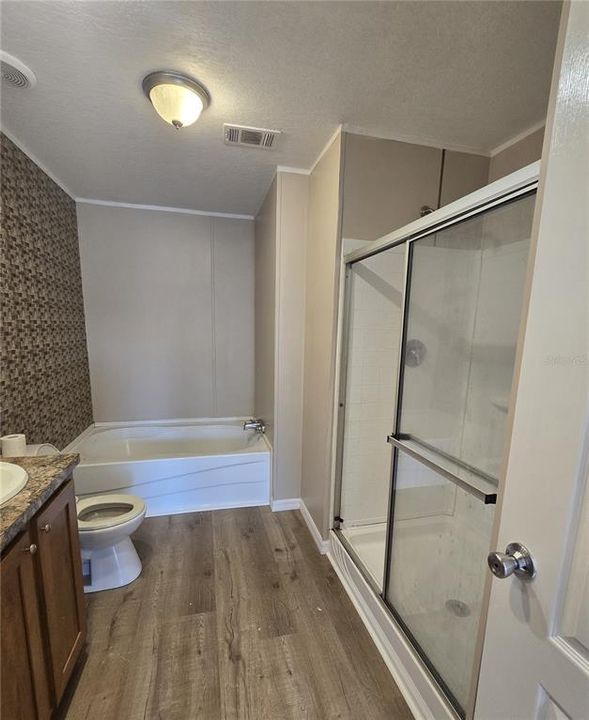 5105 (A) - The primary bath features dual sinks, soaking tub, separate shower, and linen cabinet.