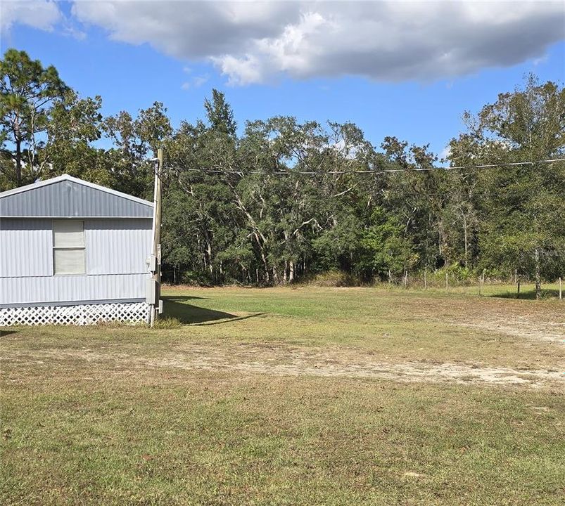 5040 S. Barker Point - Lot F - is a 3/2 single-wide manufactured home with 1,059 square feet and sits on .57 acres.