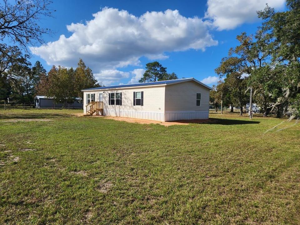 5105 (A) - fully fenced with a farm gate, shed with electrical hook up, sitting on .57 acres.