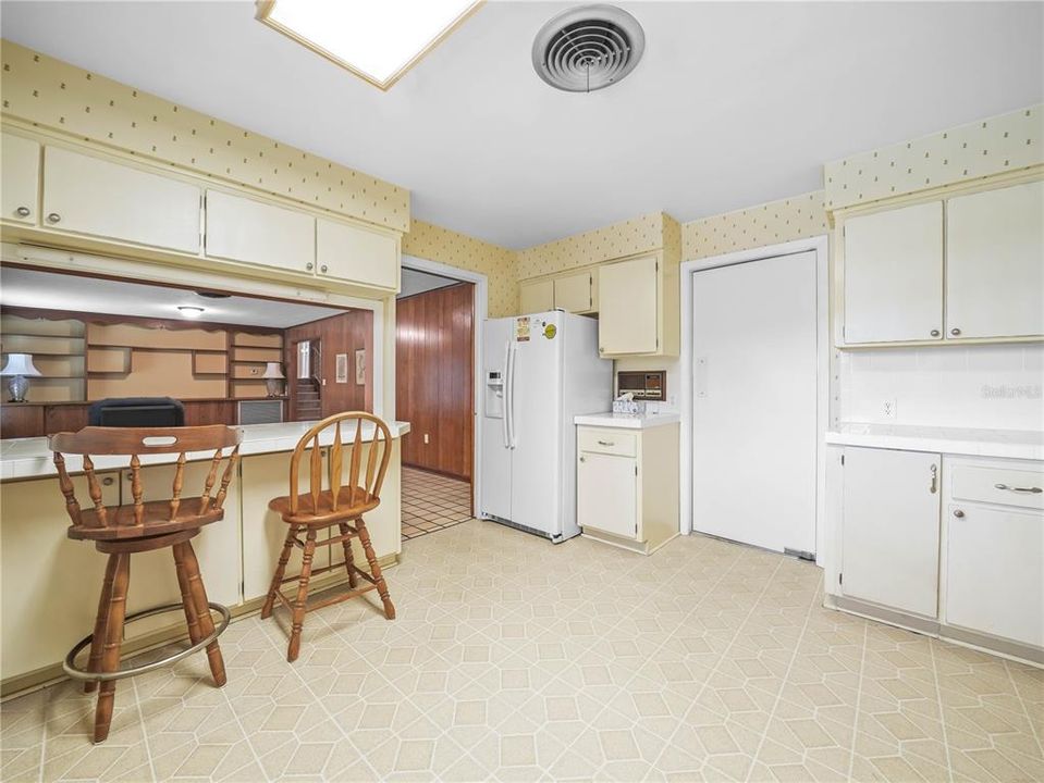 KITCHEN DOOR LEADING TO FORMAL DINING AND LIVING ROOMS