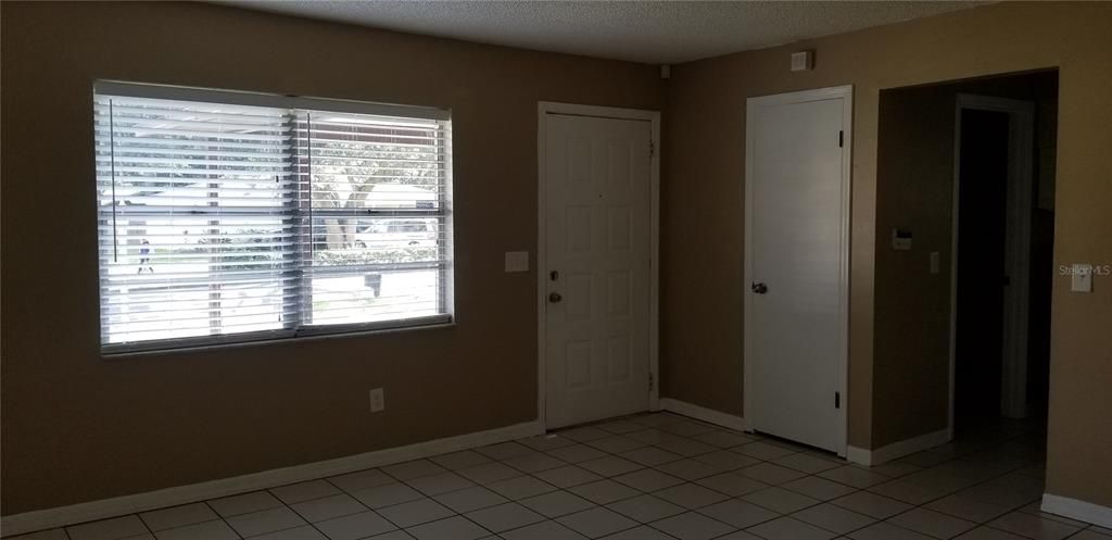 Front door, front closet, and Living/Dining room