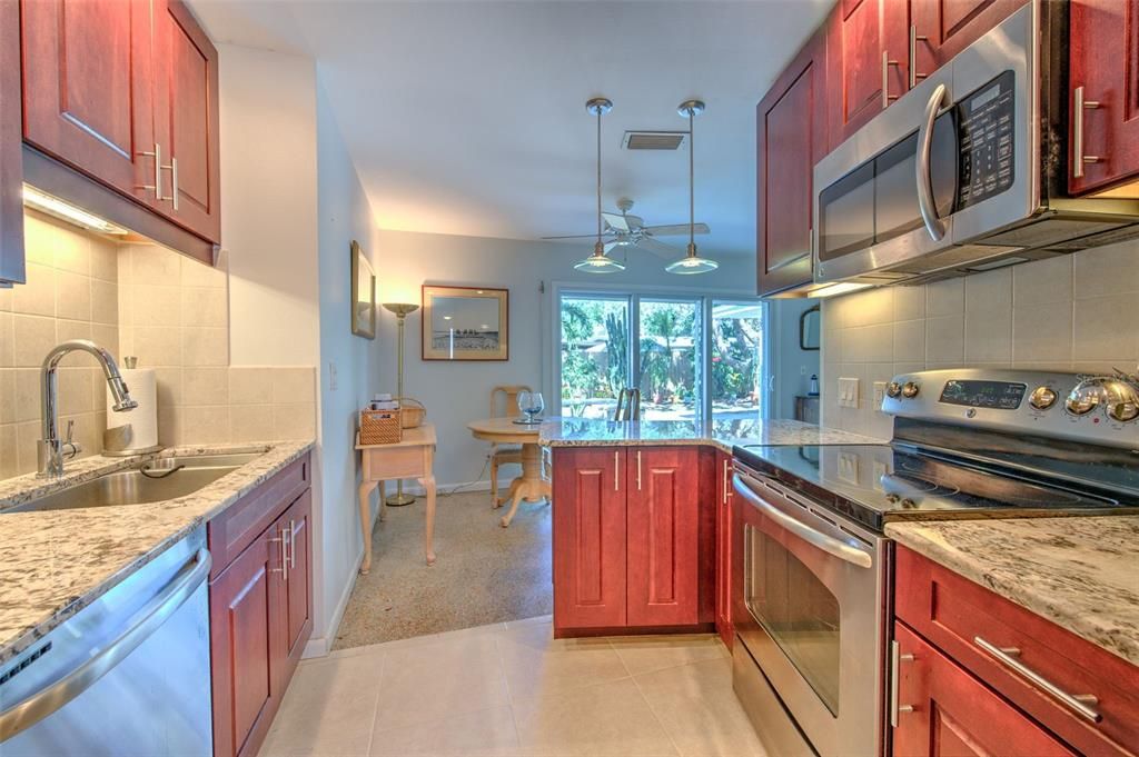 Kitchen with beautiful granite and Stainlee Steel Appliances