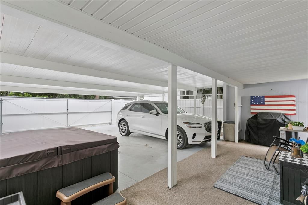 spacious covered carport with privacy gate (closed)