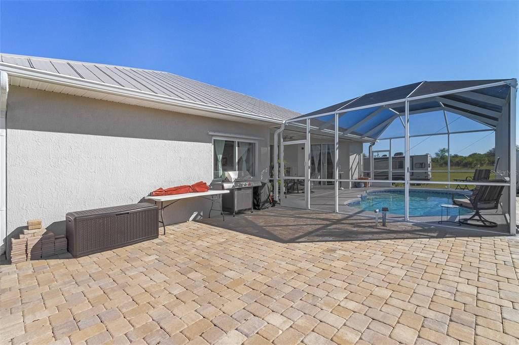 Side patio fully paved outside of lanai