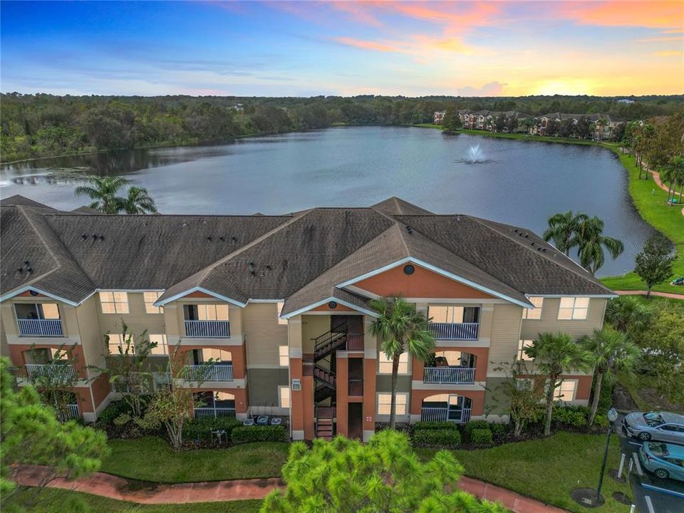 Picturesque lake with walking paths, perfect for enjoying Florida sunsets and serene views.