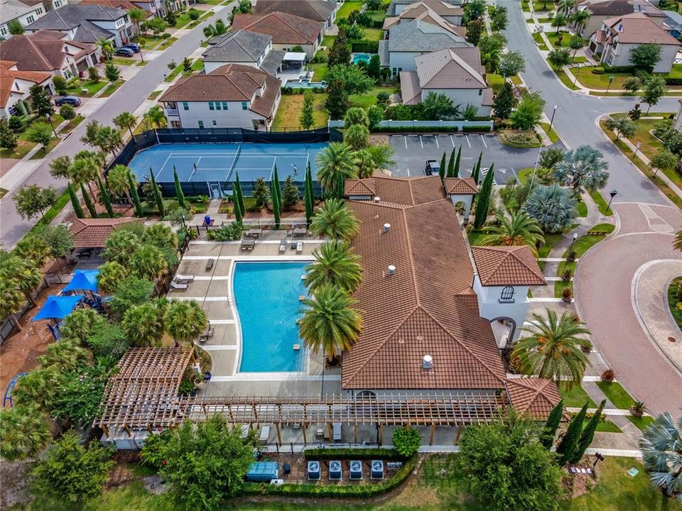 View of the community pool, playground, tennis courts