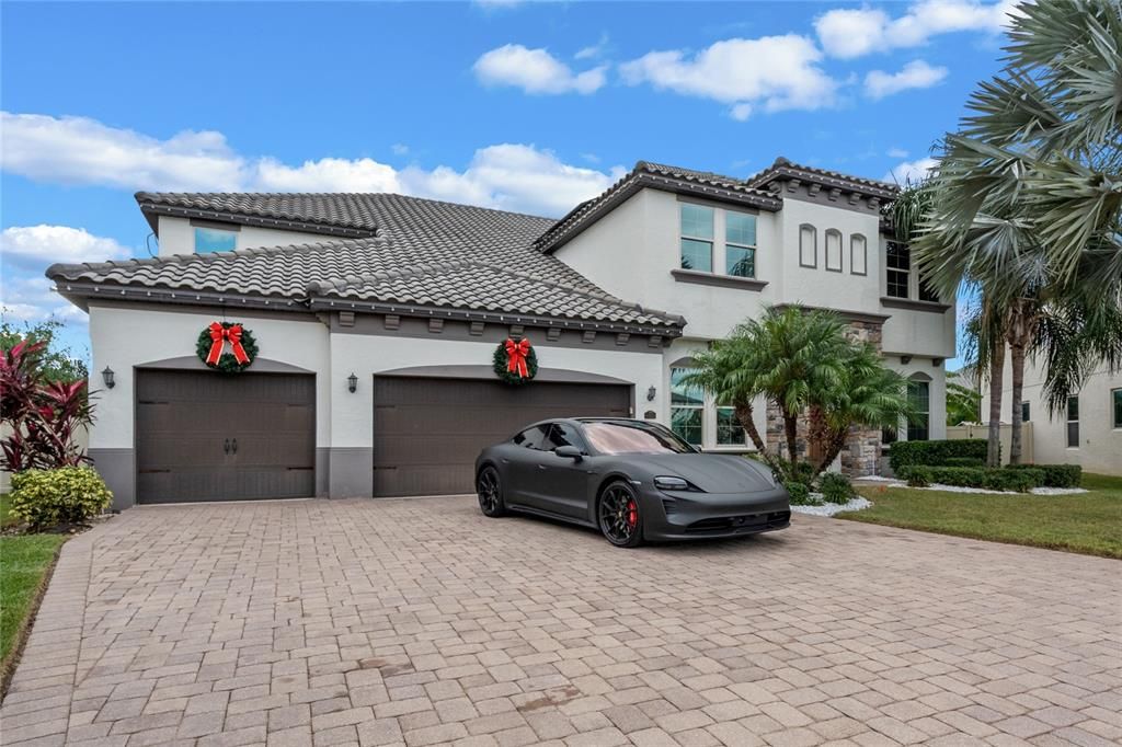 This stunning Mediterranean-style home is nestled on one of the largest lots in the prestigious Parkside neighborhood