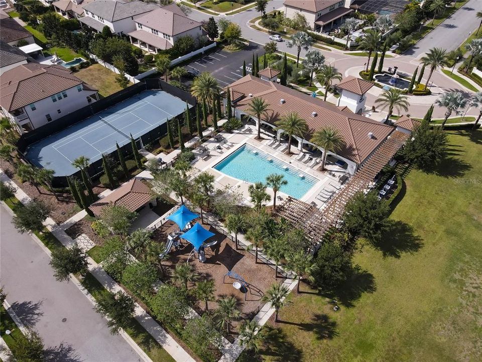 View of the community pool, tennis courts, soccer field and playground