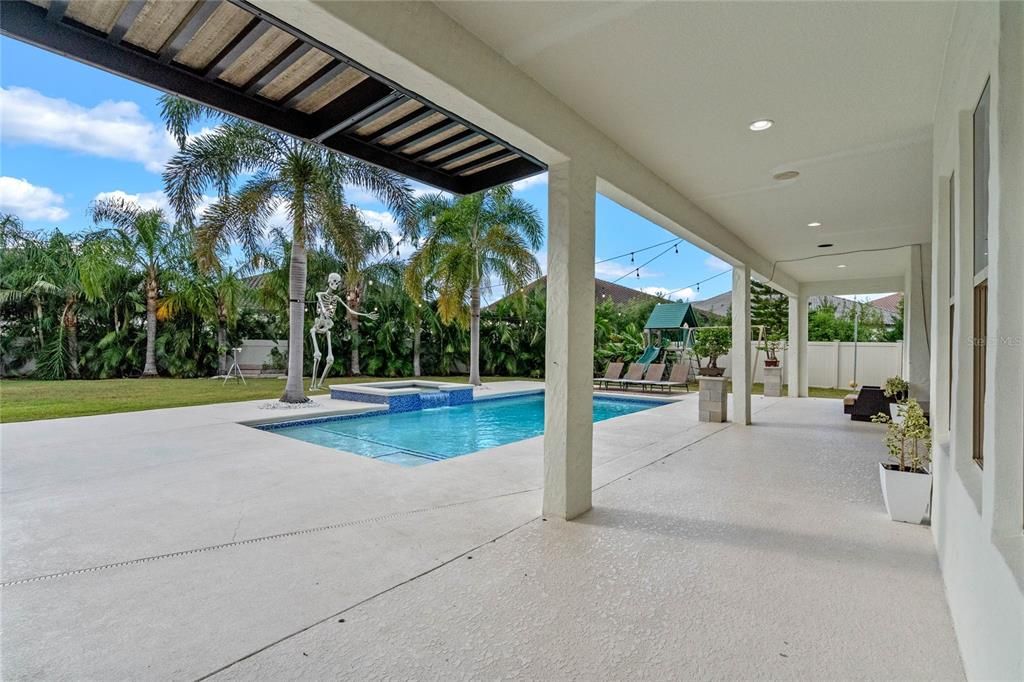 View of the covered patio from the summer kitchen area.