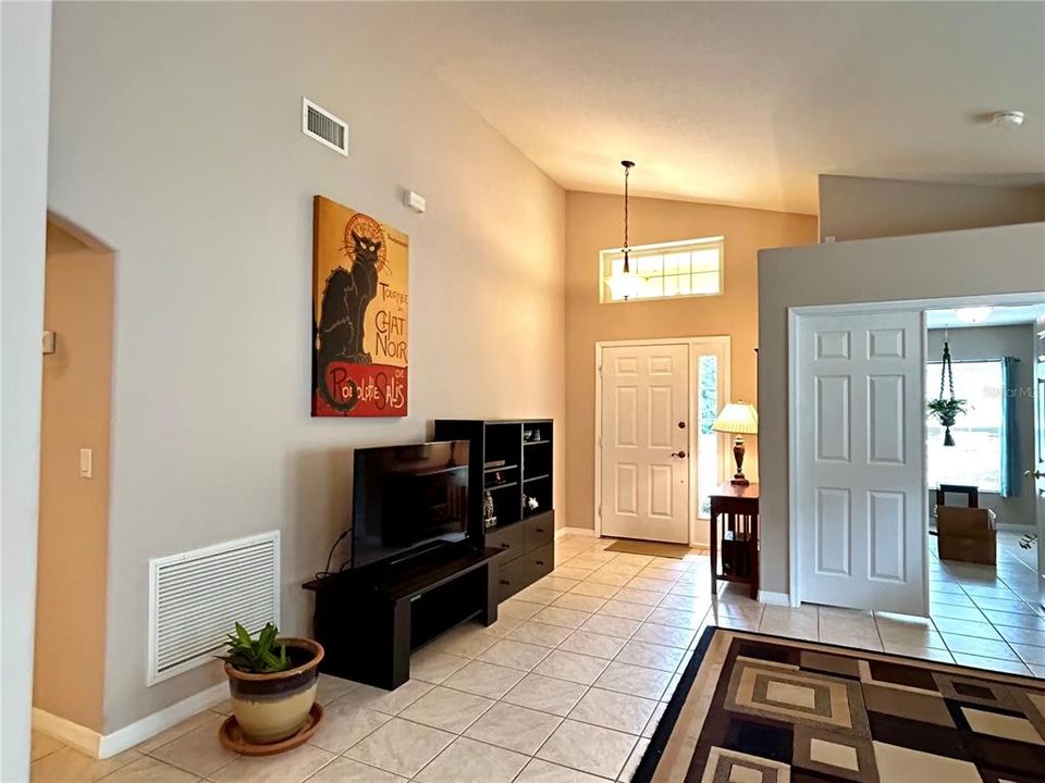 Living Room with view of foyer and 4th BR/Office