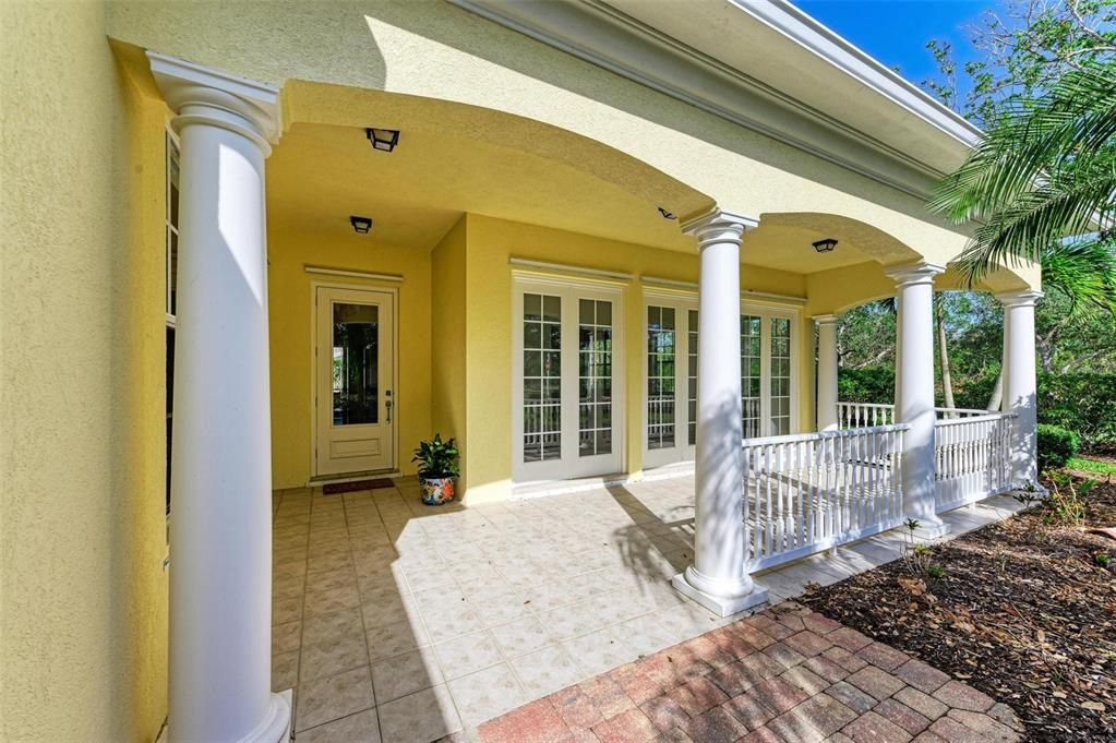 Charming front porch is perfect for a morning cup of coffee as you enjoy the scenery.