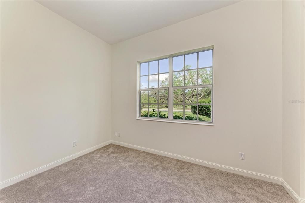 One of three Guest Bedrooms all with new carpet, walk in closet with built ins.