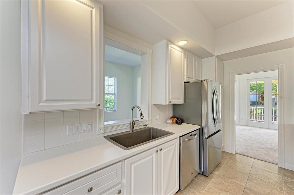 Kitchen with new refrigerator.