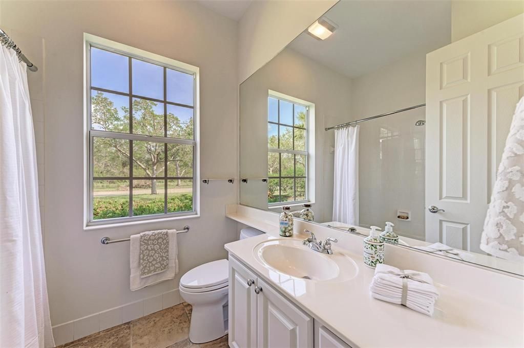 Guest bathroom is located just off of the Guest bedroom and off of the Kitchen area so can also be used as Powder room