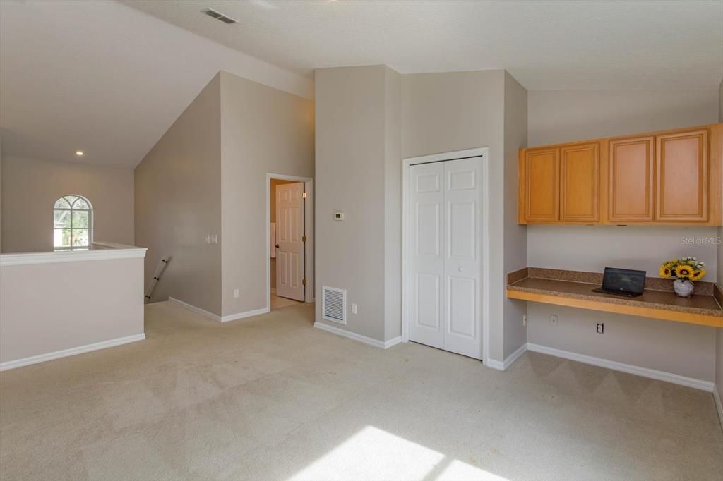 Built in computer desk and storage closet in the loft