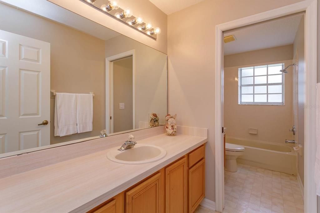 Bathroom 3 has 2 sinks and a pocket door