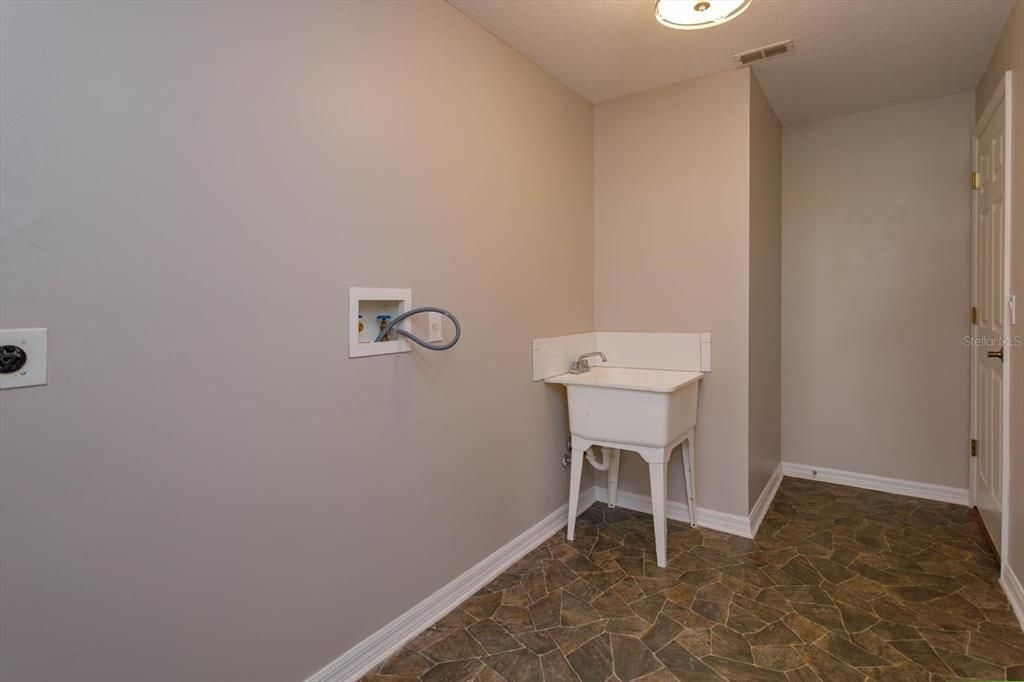 Downstairs laundry room is 10 x 6 with utility sink